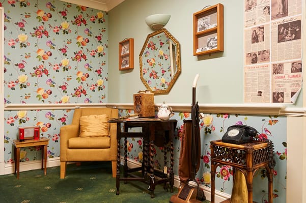 A cozy corner of a common area with vintage decor