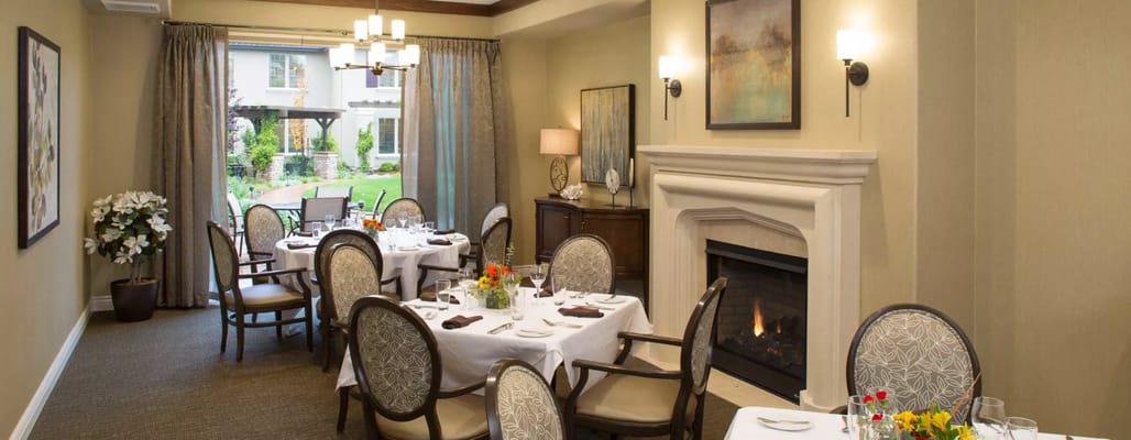 Elegant dining room with tables set for a meal
