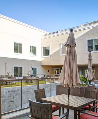 Outdoor seating area with umbrellas in a courtyard