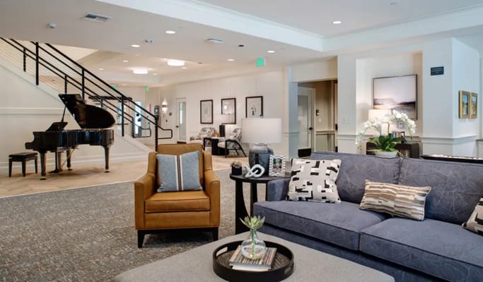 Bright common area with a piano and seating