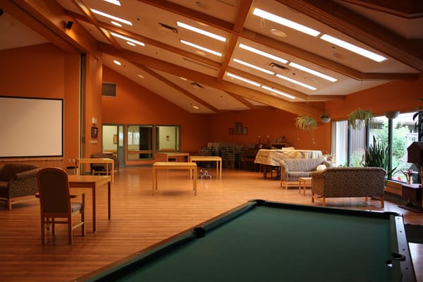 Interior common area with seating and activities