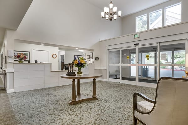 Interior view of a welcoming lobby area with flowers
