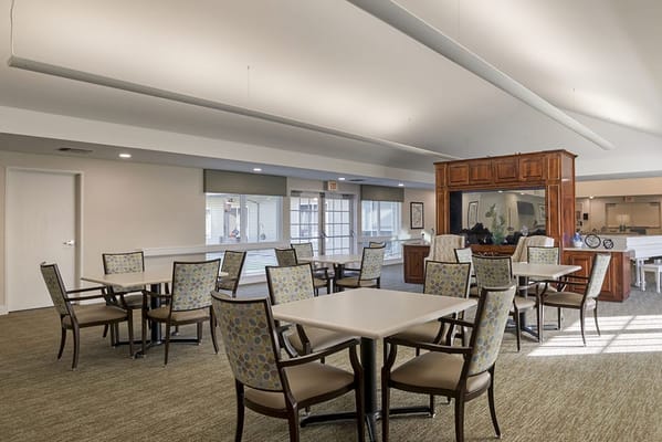 Bright common area with tables and chairs