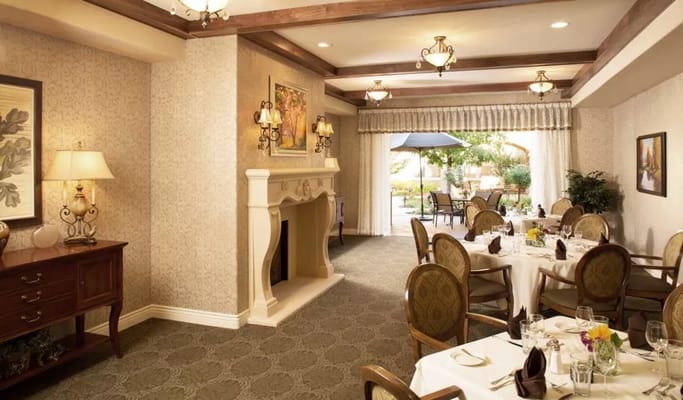 Elegant dining room with tables set for a meal