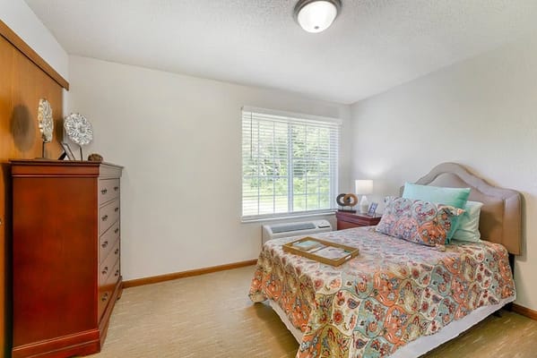 Cozy interior of a private resident room with a bed