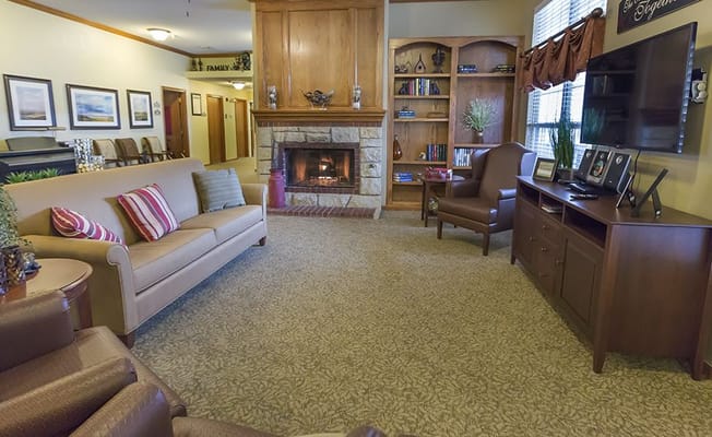 Cozy common area with seating and fireplace