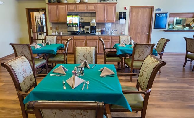 Dining area with tables set for a meal