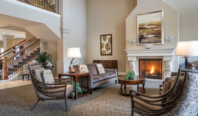 Cozy lounge area with a fireplace and seating