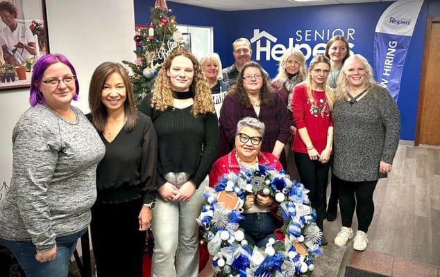Group of staff members posing in a common area