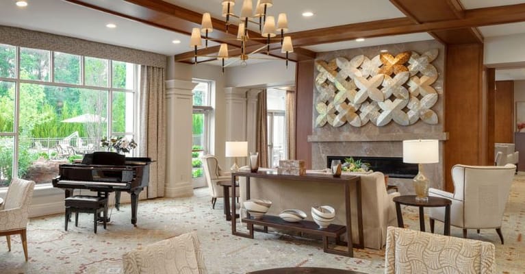 Spacious living room with piano and decorative wall art