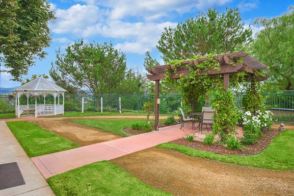 Serene garden area with a gazebo and seating