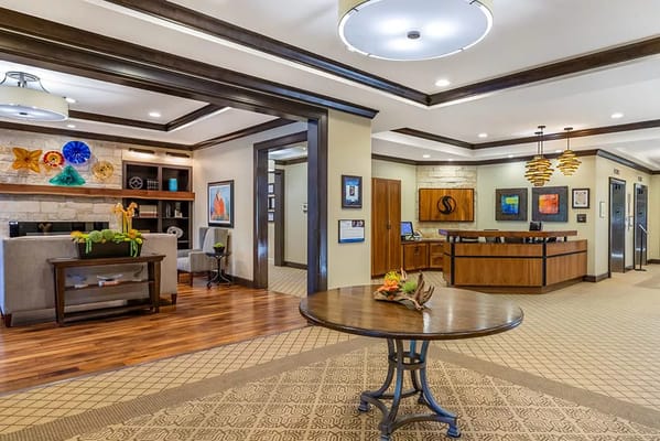 Bright and modern lobby area with seating and reception desk