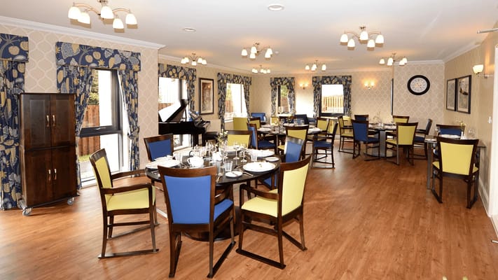 Interior view of a dining room with tables and chairs