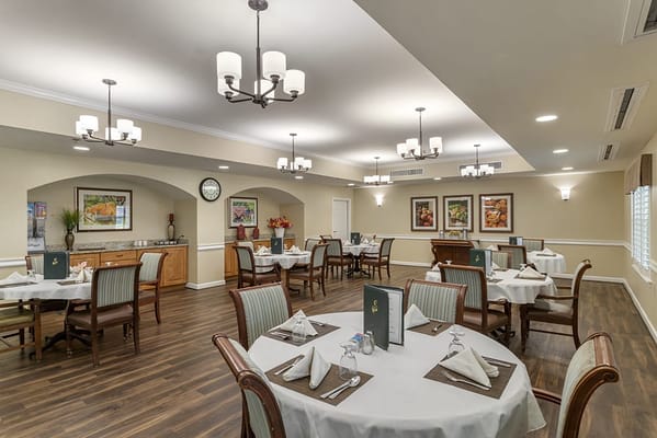 Elegant dining area with set tables and decor