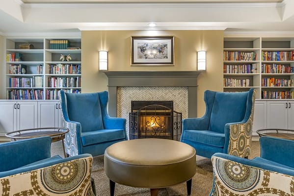 Cozy common area with armchairs and fireplace