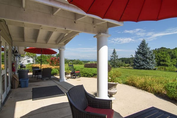 Outdoor patio area with seating and umbrellas