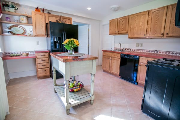 Modern kitchen with wooden cabinets and a kitchen island