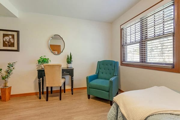 Cozy resident room with a desk and chair
