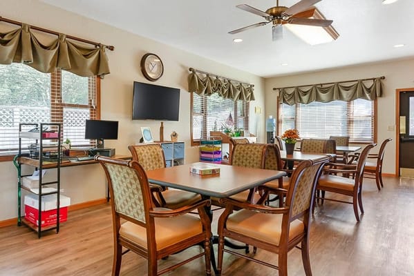 Bright common area with tables and chairs