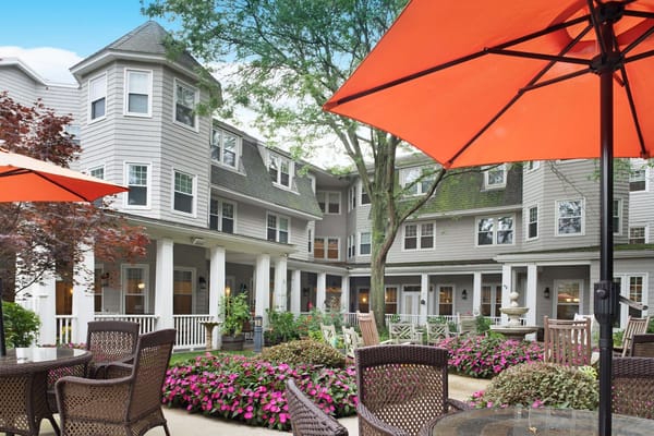 Outdoor courtyard with flowers and umbrellas