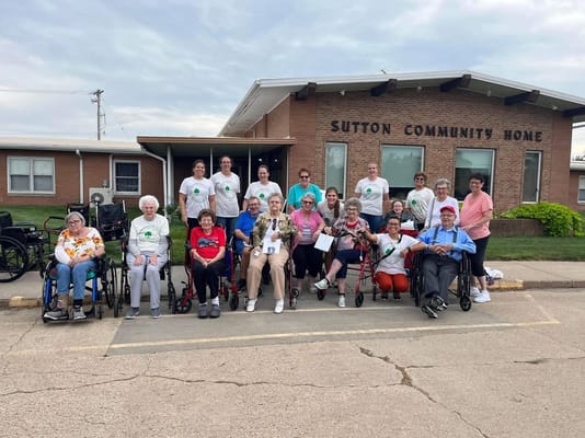 Group of residents and staff outside Sutton Community Home