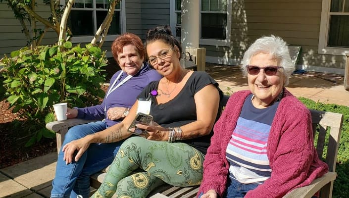 Residents enjoying time outdoors on a bench