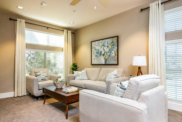 Bright, comfortable common area with seating and decor