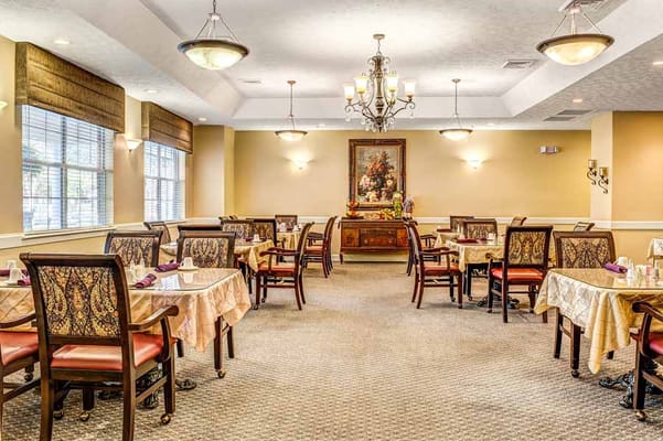 Cozy dining room with tables set for meals