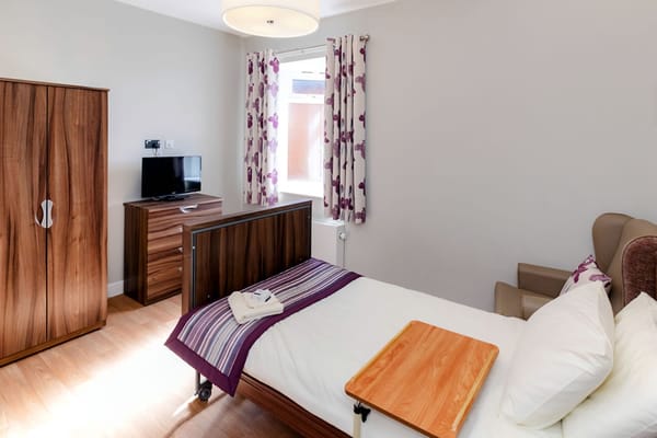 Private resident room with a bed and furnishings