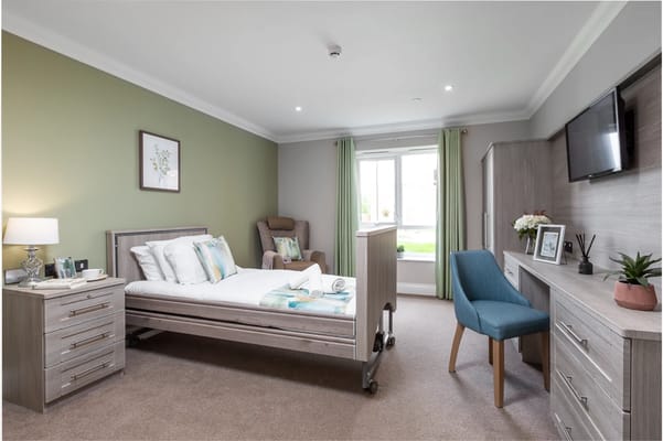 A well-furnished bedroom in The Maples Care Home.