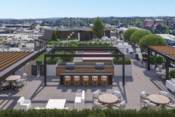 Stylish rooftop garden with seating and BBQ areas at The Springs at The Waterfront