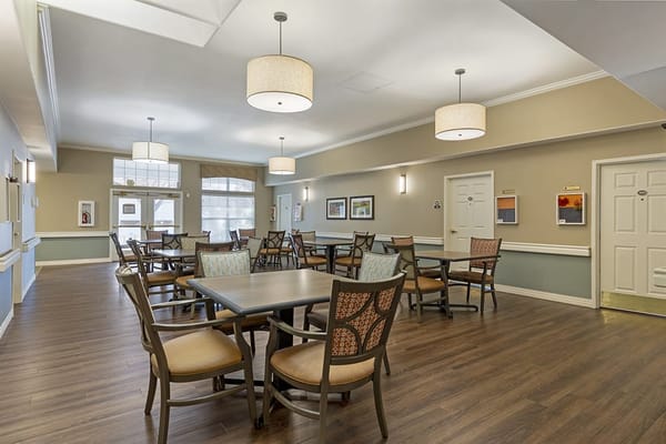 Bright common area with seating and tables