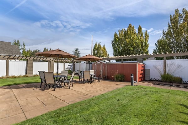 Outdoor patio area with seating and umbrellas
