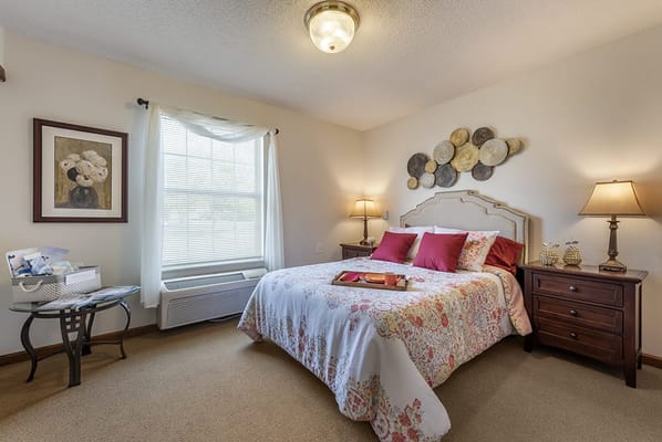 Cozy, well-decorated private bedroom with floral bedding