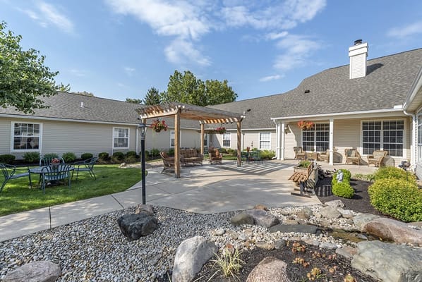 A serene outdoor area with seating and gardens