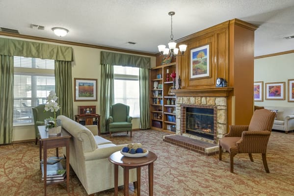 Cozy common area with a fireplace and seating