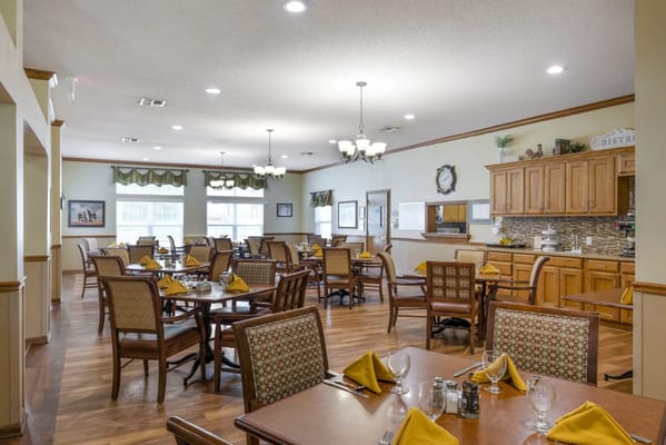 Dining room with tables set for residents