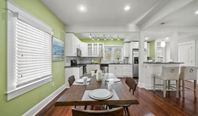 Bright kitchen area with wooden dining table