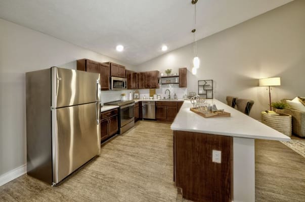 Spacious kitchen with stainless steel appliances and a large island