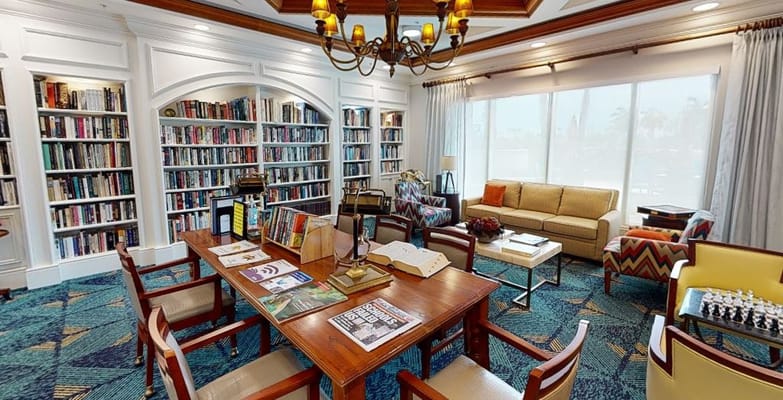 Interior view of a cozy library and common area