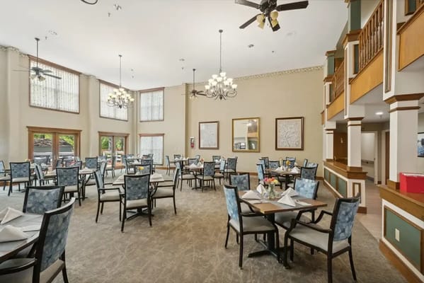 Spacious dining room with tables set for meals