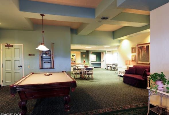 Interior view of the game room with pool table and seating area