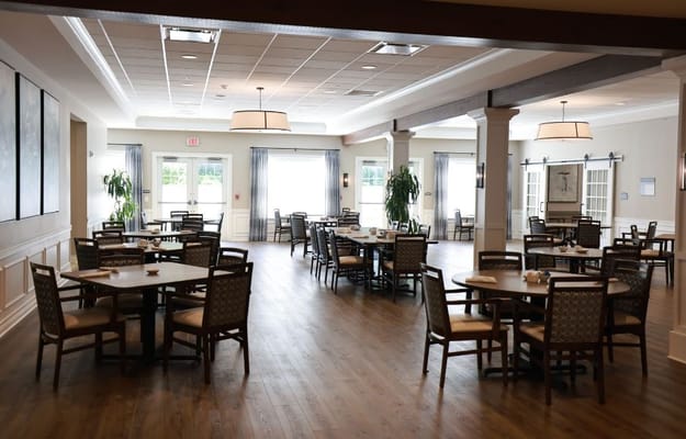 Bright dining area with tables and chairs