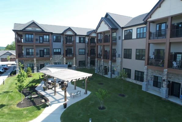 Aerial view of a senior living facility with outdoor space