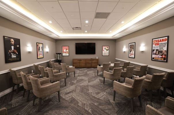 Common area with seating and movie posters