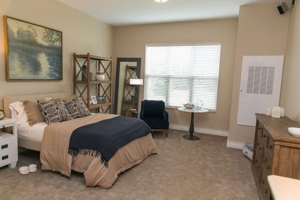 Cozy resident room with a bed and seating area