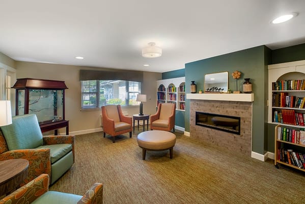 Cozy common area with seating and bookshelves