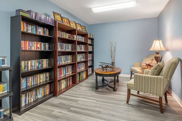 Cozy interior library with bookshelves and seating