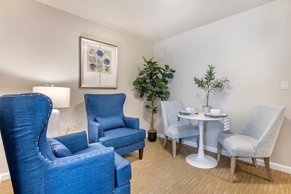 Cozy interior seating area with chairs and a small table