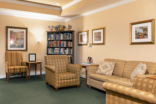 Cozy common area with seating and bookshelves